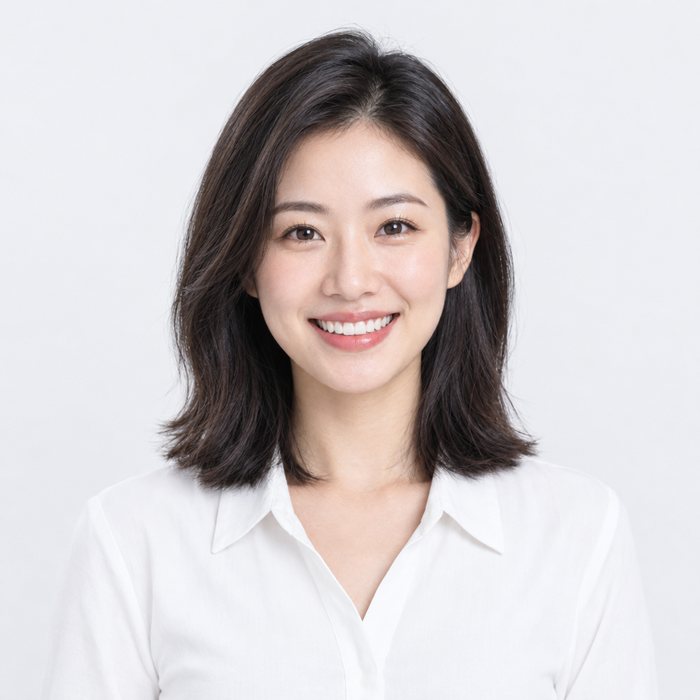Smiling young woman in a white blouse